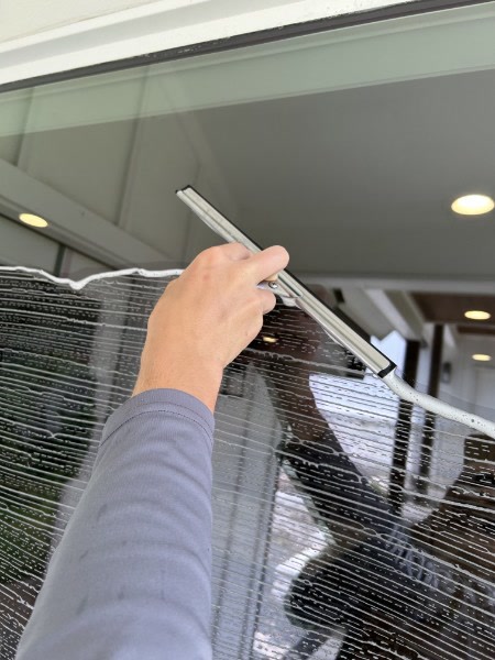 Window cleaning with squeegee