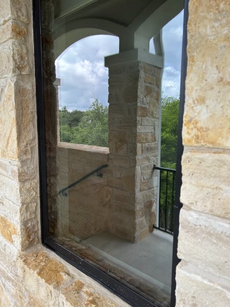 Clean window on limestone stone exterior